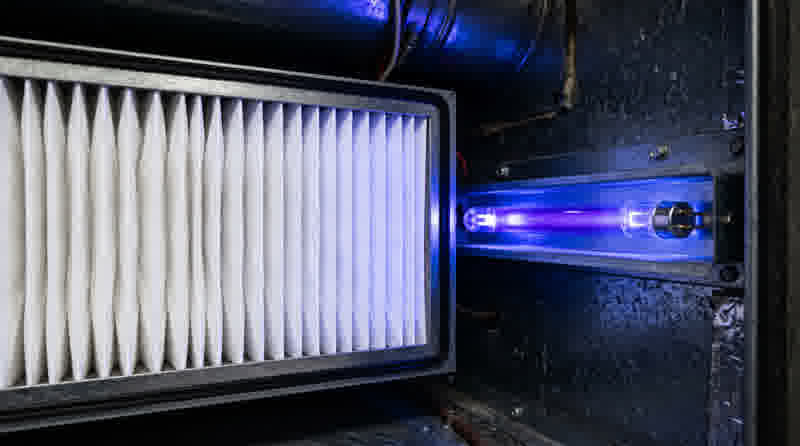 Indoor air quality — HEPA filter next to a UV-C germicidal lamp in an air handler